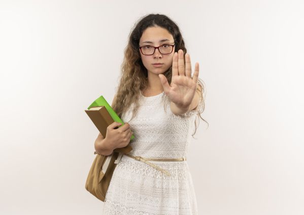 young-pretty-schoolgirl-wearing-glasses-back-bag-holding-books-looking-gesturing-stop-camera-isolated-white-background-with-copy-space__600x423