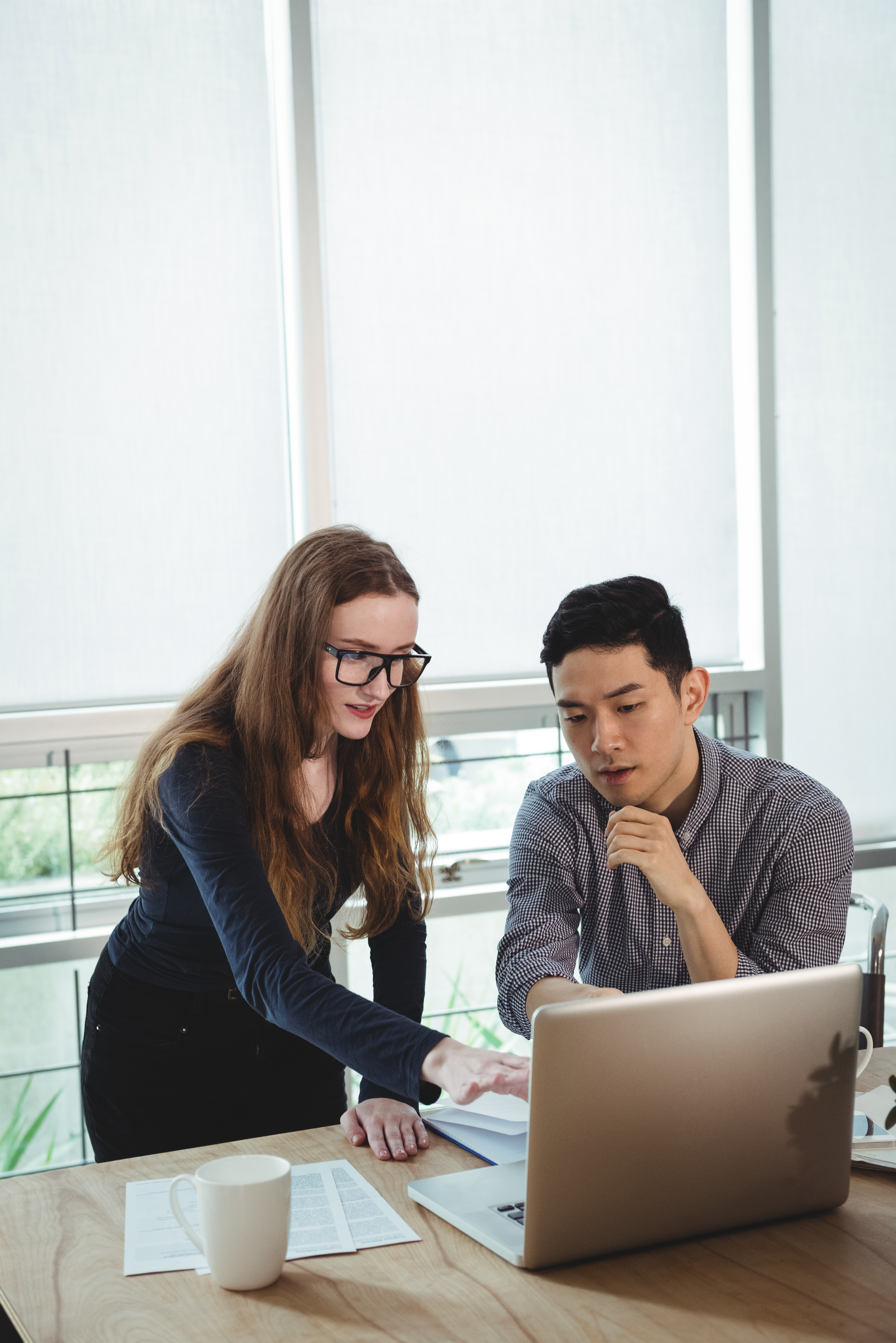 business-executives-discussing-laptop business-executives-discussing-laptop