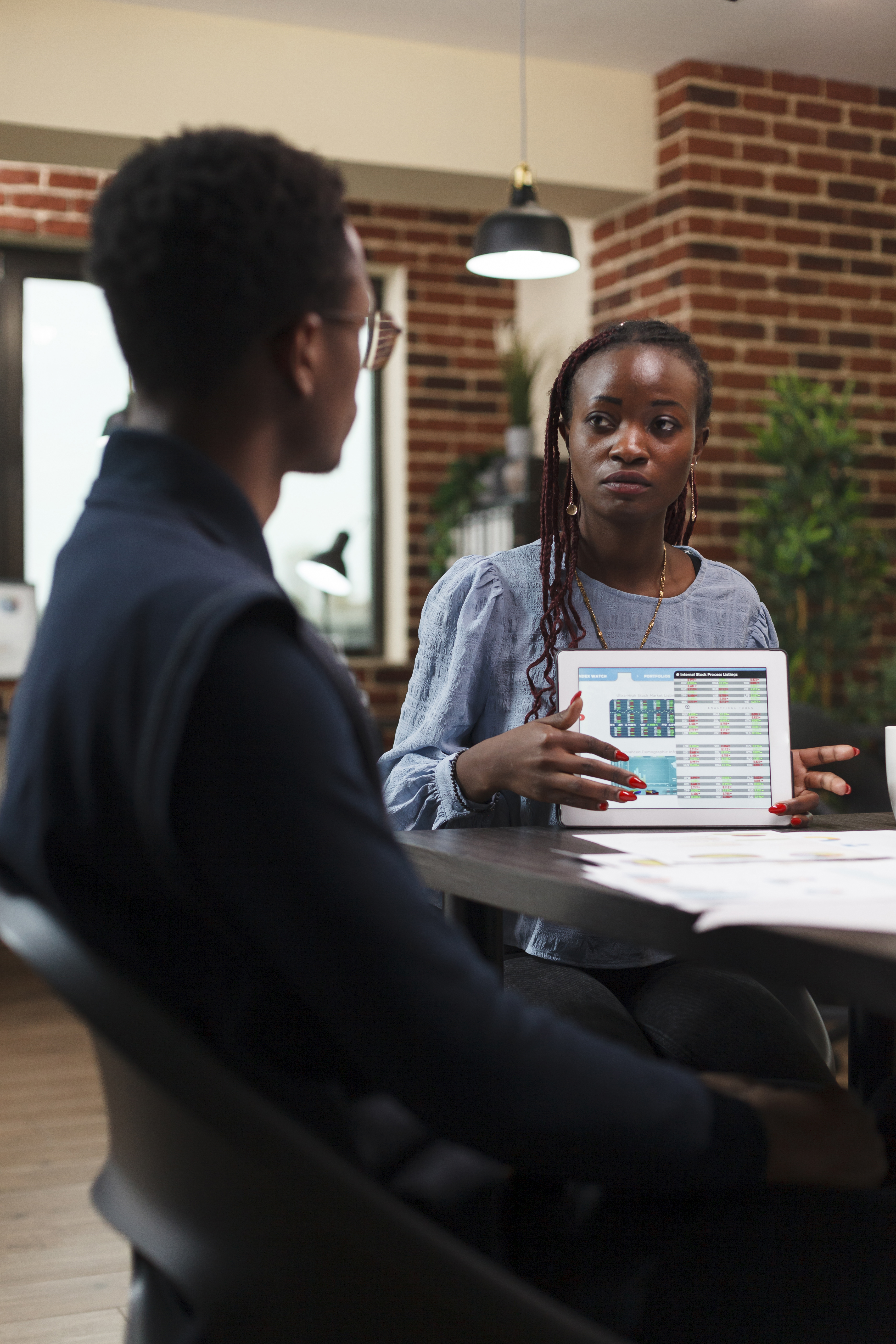 african-american-business-woman-presenting-coworker-accounting-documentation-statistics-data-tablet-accountant-being-briefed-by-project-manager-about-wrongly-declared-income-expenses
